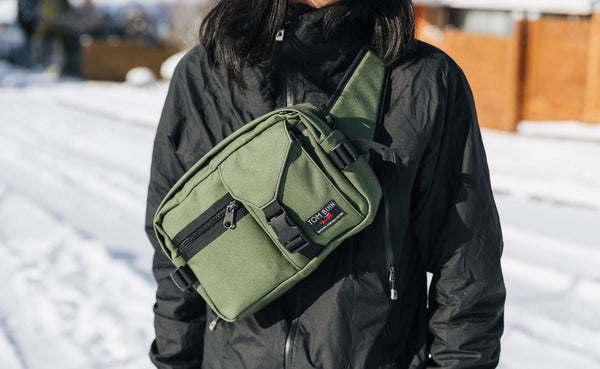 Person wearing the LPD in Boreal sling-style, on their front.